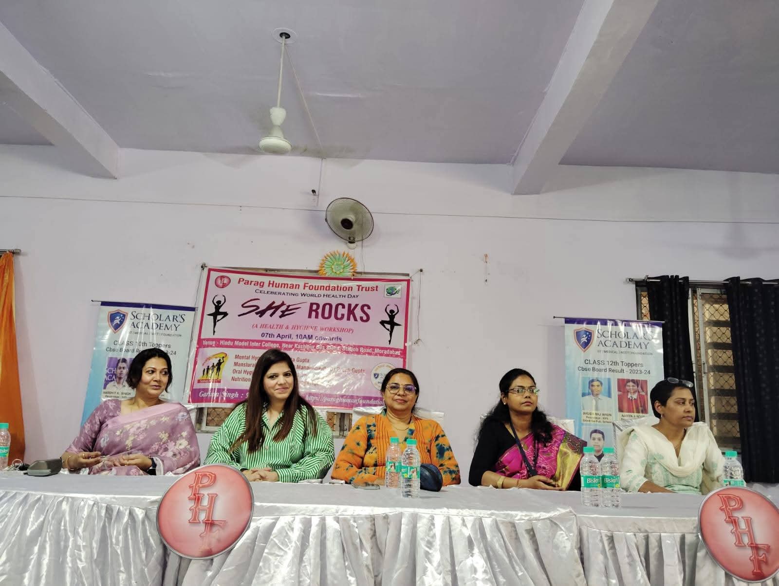 Distinguished panel of expert speakers seated behind table